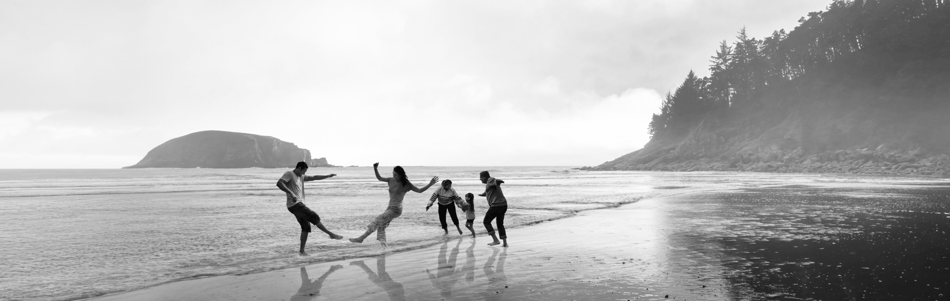 Family playing on the beach